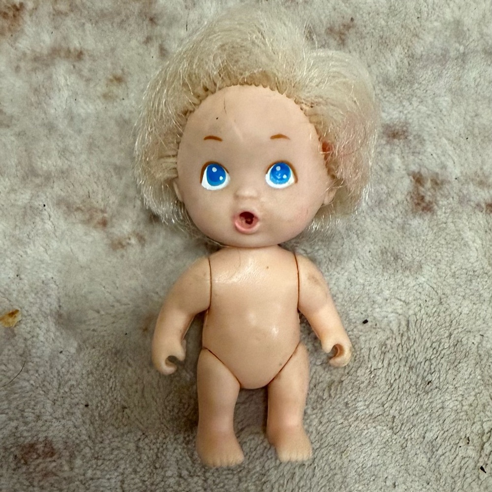 This is a vintage Tyco Playful Quints Blonde Baby Boy Doll from 1990.